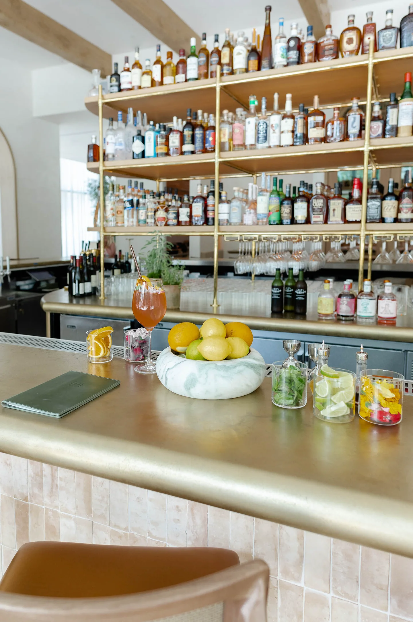 The brass bar at Predalina, lit from beneath the counter